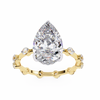 Yellow Gold Pear Cut Diamond Ring with Hidden Halo and Spaced Round Eternity Accents