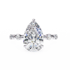 White Gold Pear Cut Diamond Ring with Hidden Halo and Spaced Round Eternity Accents