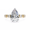 Yellow Gold Pear Cut Diamond Ring with Hidden Halo and Shared-Prong Eternity Accents