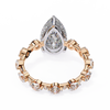 Rose Gold Pear Cut Diamond Ring with Round Eternity Band and Hidden Halo