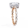 Rose Gold Radiant Cut Diamond Ring with Pear and Round Accent Band