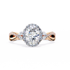 Rose Gold Oval Cut Diamond Halo Ring with Marquise Accents and Twisted Pavé Band