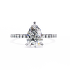 White Gold Pear Cut Diamond Ring with Hidden Halo and Pavé Shoulders