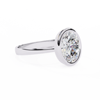 White Gold Oval Cut Diamond Solitaire Ring with Full Bezel Setting and Plain Tapered Band