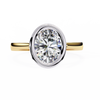Yellow Gold Oval Cut Diamond Solitaire Ring with Two-Tone Bezel Setting