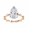 Rose Gold Pear Cut Diamond Ring with Hidden Halo and Spaced Round Eternity Band