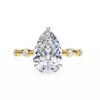 Yellow Gold Pear Cut Diamond Ring with Hidden Halo and Spaced Round Eternity Accents