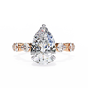 Rose Gold Pear Cut Diamond Ring with Round Eternity Band and Hidden Halo