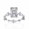 White Gold Emerald Cut Diamond Ring with Pear and Round Eternity Accents