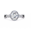 White Gold Oval Cut Diamond Halo Ring with Marquise Accents and Twisted Pavé Band