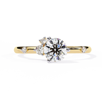 Gold Round Diamond Solitaire Ring with Scattered Accent Diamonds