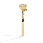 Gold Round Diamond Solitaire Ring with Scattered Accent Diamonds