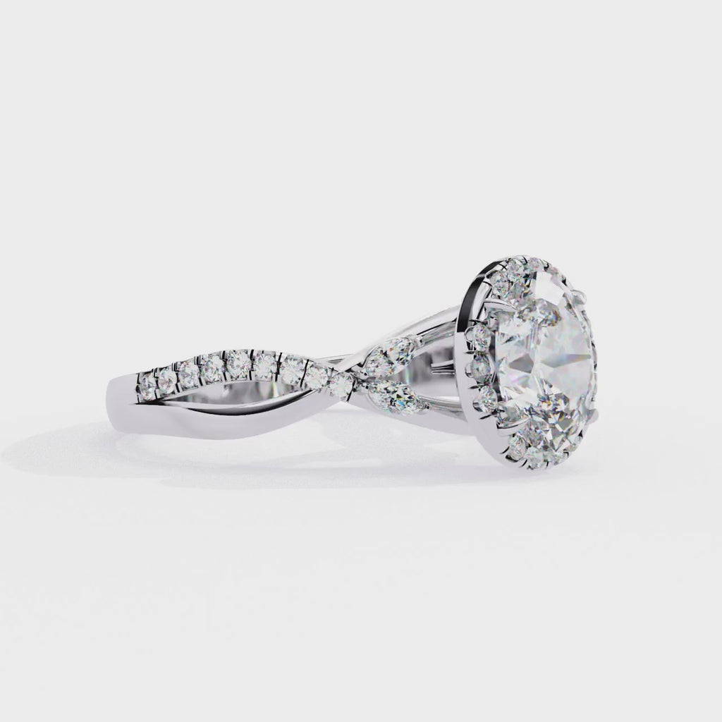 White Gold Oval Cut Diamond Halo Ring with Marquise Accents and Twisted Pavé Band