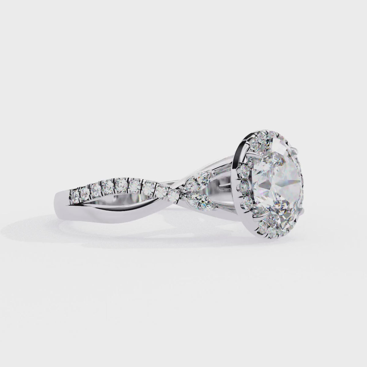 White Gold Oval Cut Diamond Halo Ring with Marquise Accents and Twisted Pavé Band